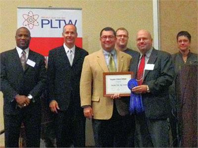  Teacher Michael Haydn receiving PLTW certification.